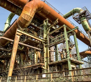metal pipes structure against clear sky